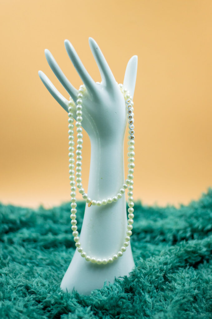 long pearl necklace with text beads